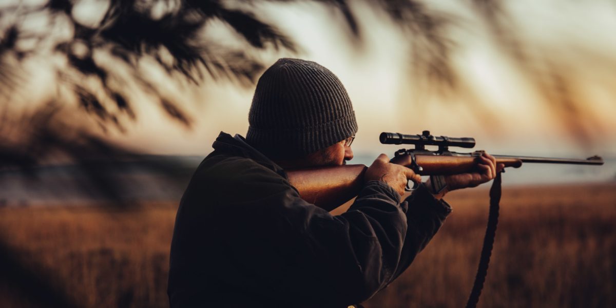 hunter taking shot with rifle t20 WQbK9g 1 scaled